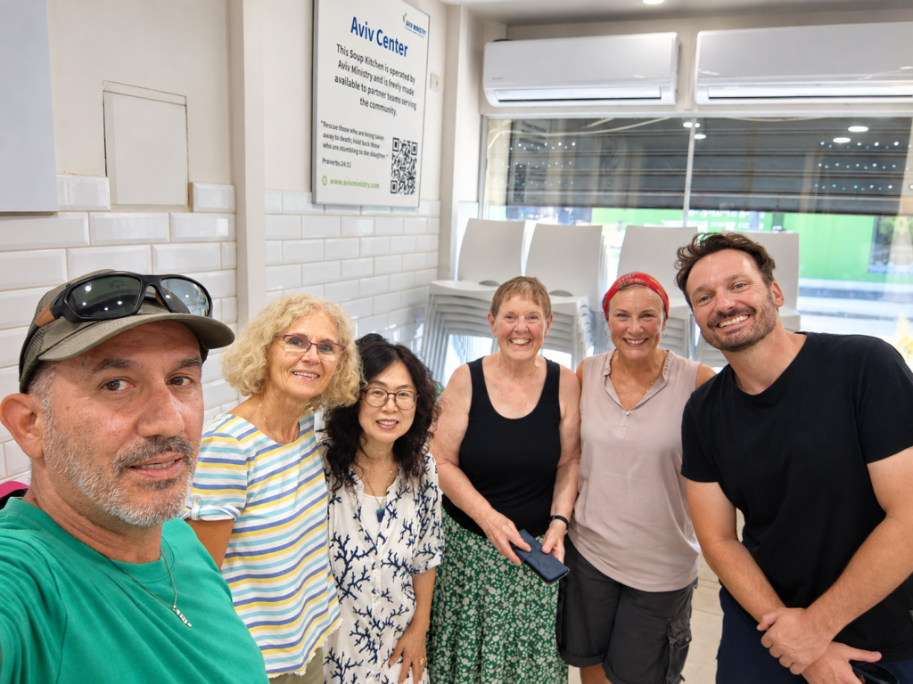 KBN Israel volunteers together inside the Tel Aviv Soup Kitchen.